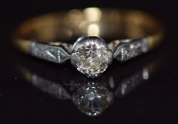An 18ct gold ring set with a diamond of approximately 0.25ct in a platinum setting, 2g, size I