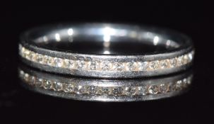 A platinum eternity ring set with diamonds by Eric Smith, in original box, 3.4g, size H