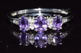 A 9k white gold ring set with amethysts and diamonds, 2.3g, size Q