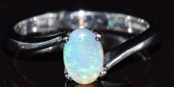 A 9ct white gold ring set with an opal, 2.9g, size M