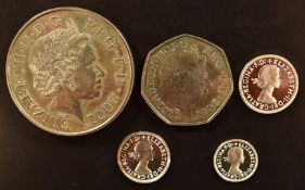 2001 Maundy coins comprising 2d, 3d and 4d together with a 2001 £5 and 50p, purchased by the