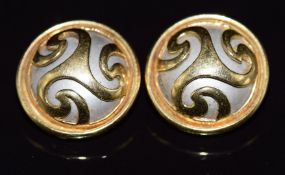 A pair of 18ct gold earrings set with a silver disc with swirl decoration, 11.3g