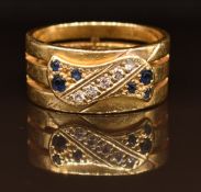 An 18ct gold ring set with sapphires and diamonds,7.8g, size J
