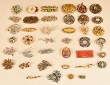 A collection of brooches, two Burmese comprising one silver and one coral and turquoise, gold