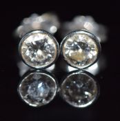A pair of 18ct white gold earrings set with a diamond of approximately 0.4ct to each, 1.6g