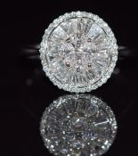 An 18ct white gold ring set with princess, marquise, baguette and round cut diamonds totalling