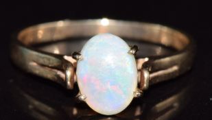 A 9ct gold ring set with an opal cabochon, 1.8g, size N
