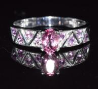 A 9ct white gold ring set with pink topaz and pink sapphires, 2.5g, size Q
