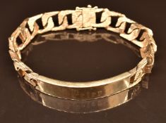 A 9ct gold curb link bracelet with textured surface and identity plaque, 46.7g