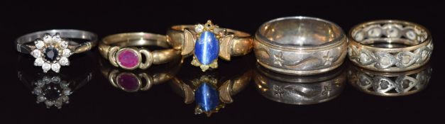 A 9ct gold ring set with a ruby, 9ct gold eternity ring, yellow metal ring (8.8g) and two silver