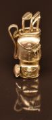 A 9ct gold charm in the form of a golf bag and clubs, 9.4g