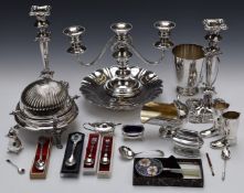 Silver plated ware including pair of candlesticks, candelabra, enamel magnifier, muffin dish and