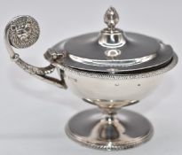 George V hallmarked silver pedestal salt with clear glass liner and lions mask to handle,