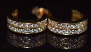 A pair of 18ct gold hoop earrings set with two rows of diamonds, 4.6g