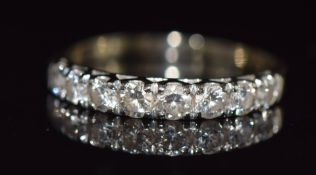 An 18ct white gold half eternity ring set with eight diamonds totalling approximately 0.62ct, 2.