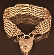 A 9ct rose gold gate bracelet with heart padlock clasp, 28.9g