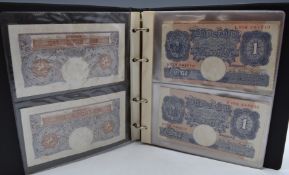 Thirty four British banknotes comprising twenty two emergency issue 1940-1941 Peppiatt £1 banknotes,