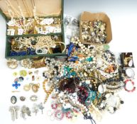 A collection of costume jewellery including vintage brooches, beads, earrings, etc