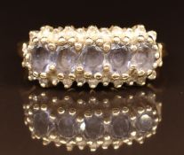 A 9k gold ring set with tanzanites and diamonds, 2.6g, size M