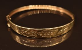 A 9ct gold bangle with foliate decoration, 6.5g, 6 x 5.5cm