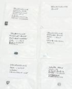 Nine loose blue tourmalines including 1.9ct emerald cut, 1.8ct pear cut, 1.1ct cushion cut, etc