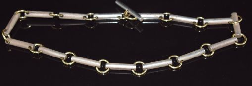 A silver and gold necklace made up of elongated links and circular links, 79.4g, 42cm long