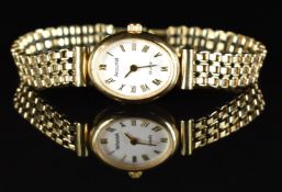 Accurist 9ct gold ladies wristwatch with gold hands and Roman numerals, white dial and quartz