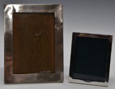 Two hallmarked silver photograph frames, the larger to suit 6 x 4 inch photo, both with easel backs