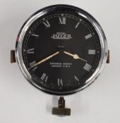 British Jaeger of Chronos Works, London car dashboard clock with Roman numerals, black dial and