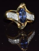 A 9k gold ring set with iolite and diamonds, 3.1g, size N