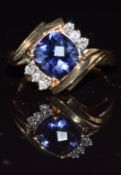 A 9k gold ring set with iolite and diamonds, 3.5g, size O