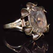 A 9ct gold ring set with an oval smoky quartz, 7.2g, size G