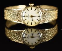 Omega 9ct gold ladies wristwatch ref. 7115526 with two-tone hands and baton hour markers, silver
