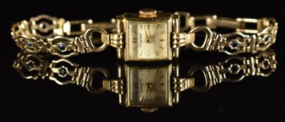 Dugena ladies wristwatch with gold hands and hour markers, reeded silver dial and unsigned movement,