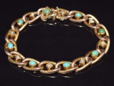 Edwardian 9ct gold curb link bracelet set with alternating turquoise cabochons and seed pearls, 18cm