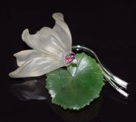 A 14k white gold brooch in the form of a lily set with nephrite jade, quartz, rubies and a
