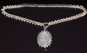 Victorian hallmarked silver locket with chased scrolling decoration, Birmingham 1881 (4 x 2.8cm)