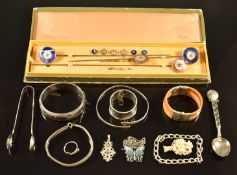 A set of hat pins, three silver bangles, silver butterfly necklace, silver tongs, silver napkin