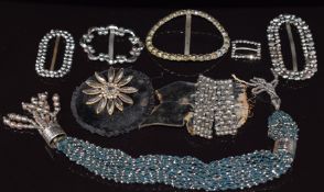 A collection of Victorian cut steel buckles, miser purse and brooch