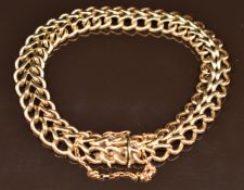A 9ct gold double curb link bracelet, 30.6g