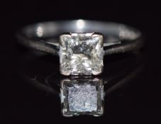 An 18ct white gold ring set with a princess cut diamond of approximately 1ct, with insurance