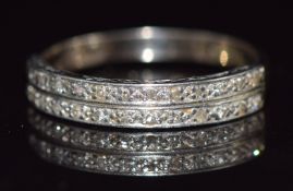 An 18ct white gold and platinum half eternity ring set with diamonds in two bands, 4.1g, size T