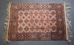 Afghan rug with red ground, having Artique Tetbury label verso, 170 x 110cm