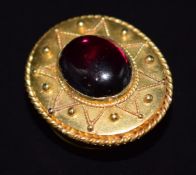 Victorian 15ct gold stud set with a garnet cabochon, stamped to back Louglas's, 2.7g, 1.8 x 1.4cm