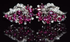 A pair of 18ct white gold earrings set with marquise cut rubies and round cut diamonds, 10.1g