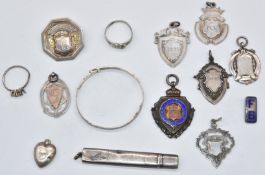 Seven hallmarked silver medallions to include an enamel Norwich Lads Club example, hallmarked silver