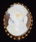 A 9ct gold brooch set with a cameo depicting a young woman, 3.5 x 5cm
