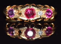 An 18ct gold ring set with a diamond and rubies, Birmingham 1915, 2.3g, size M