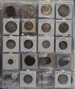 An album containing world coinage with silver content to include New Zealand, Spain, East, West