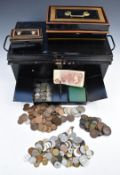 A large collection of UK and overseas coinage in a metal coin box, includes Victorian silver